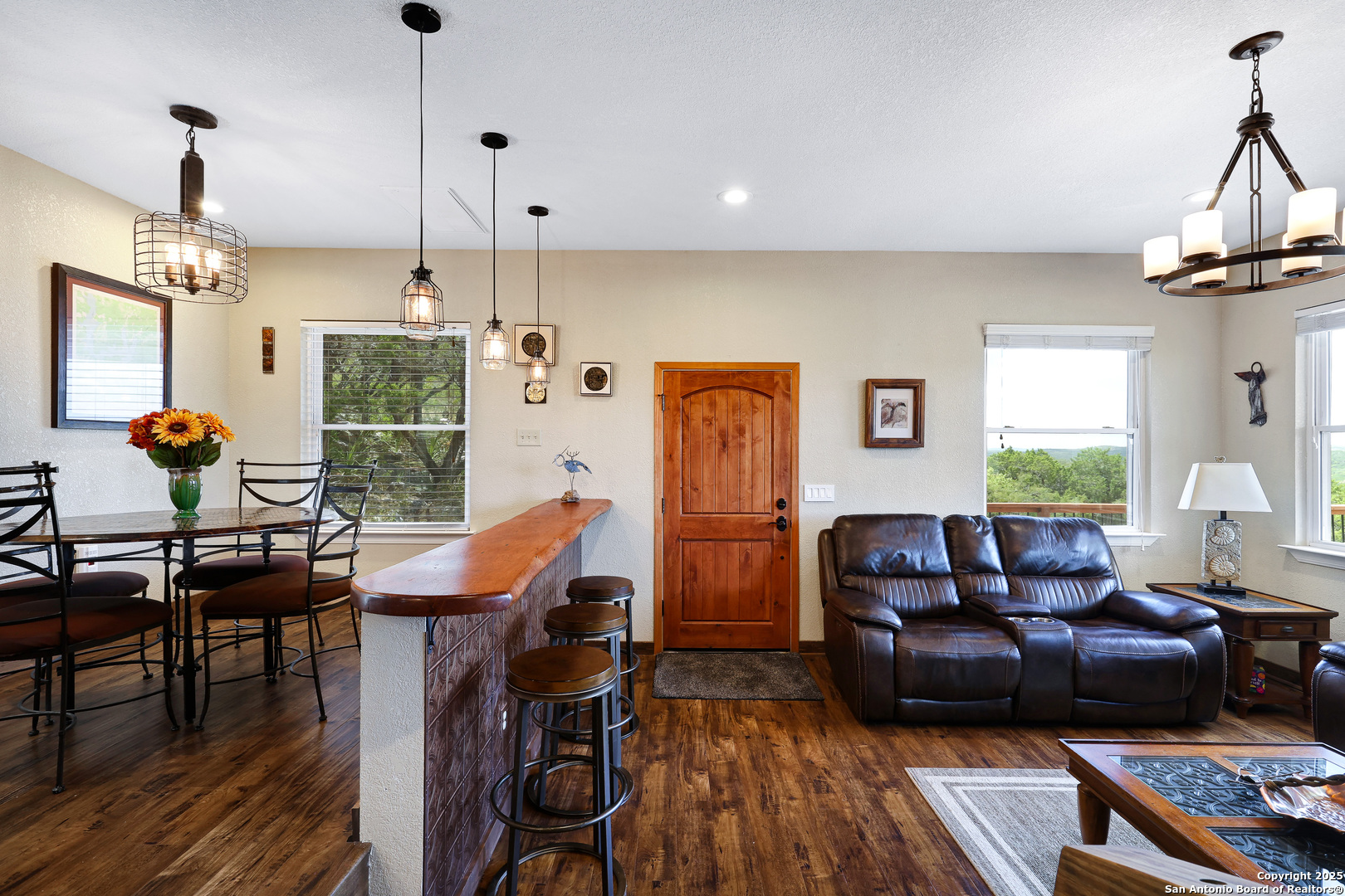 776 County Road 270 Mico, TX 78056 - Photo 13 of 59 a living room with furniture a window and gym equipment
