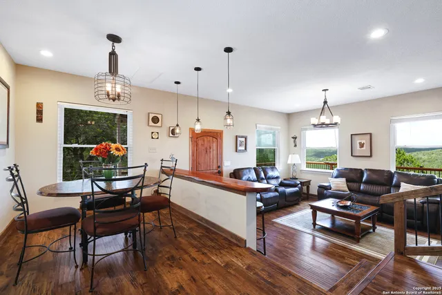 a kitchen with stainless steel appliances granite countertop a stove sink microwave and refrigerator