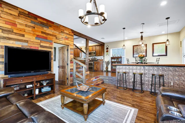 a bathroom with a sink a toilet a shower and a mirror