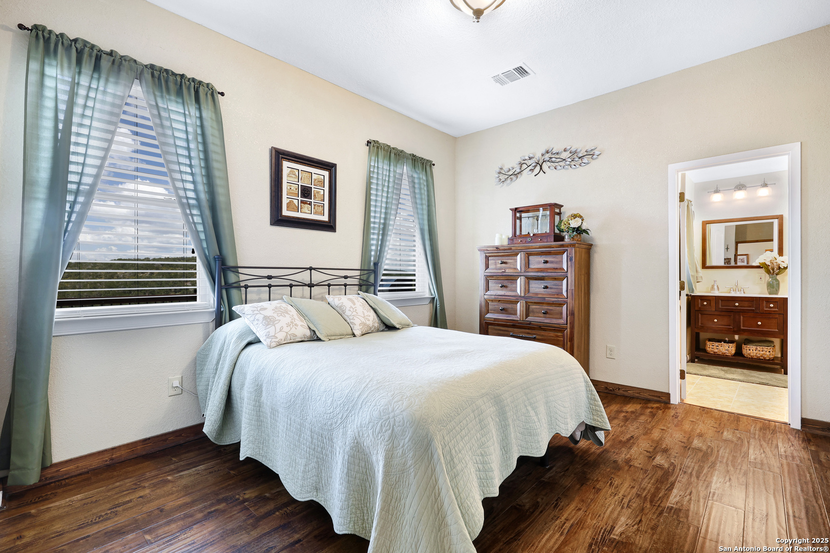 776 County Road 270 Mico, TX 78056 - Photo 23 of 59 a bedroom with a large bed and a window