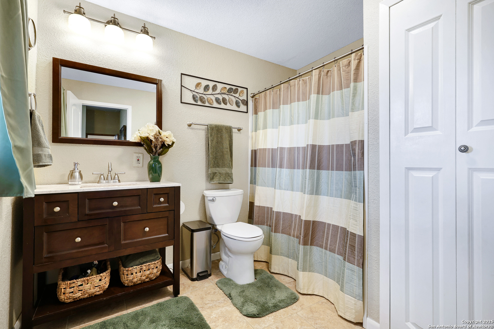776 County Road 270 Mico, TX 78056 - Photo 24 of 59 a bathroom with a sink a toilet a shower and a mirror