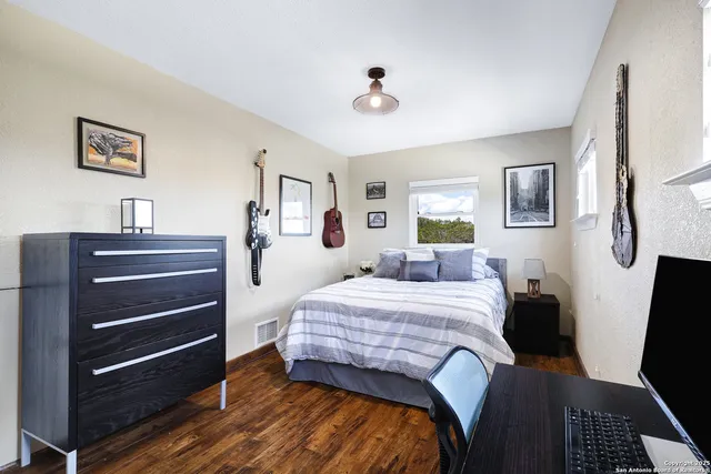 a view of a bedroom with washer and dryer