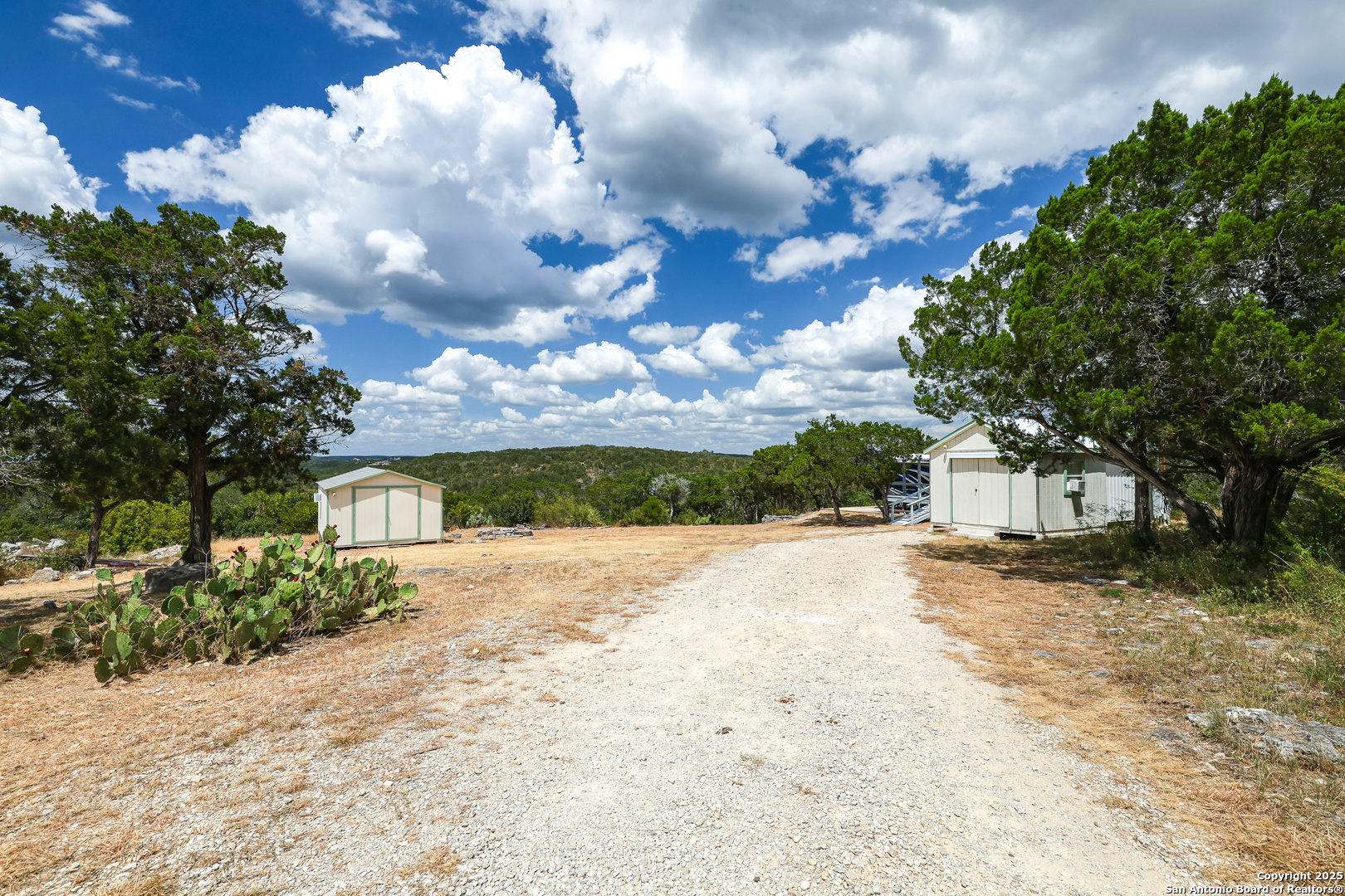 776 County Road 270 Mico, TX 78056 - Photo 37 of 59 a view of a yard with wooden fence