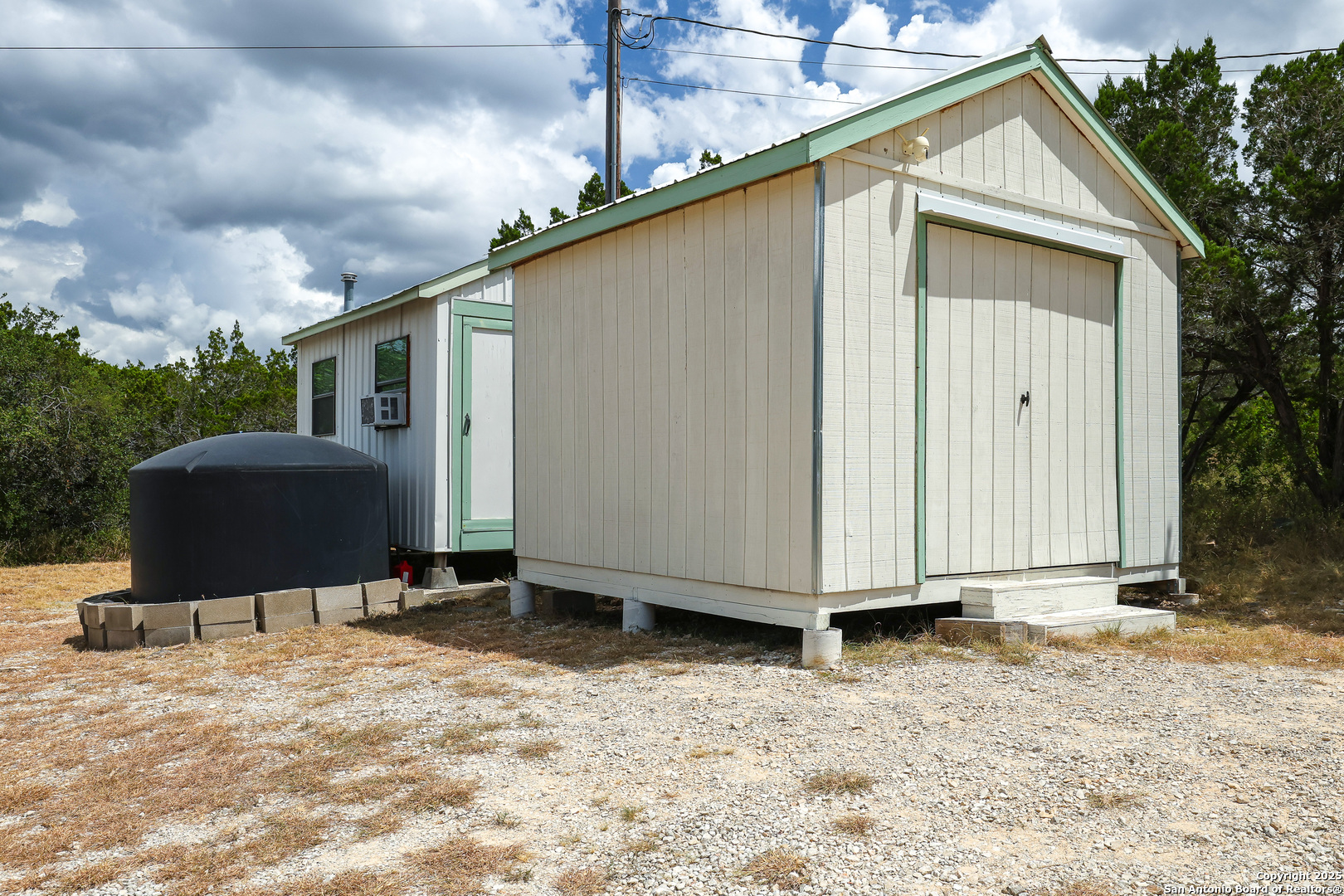 776 County Road 270 Mico, TX 78056 - Photo 43 of 59 a view of a house with backyard
