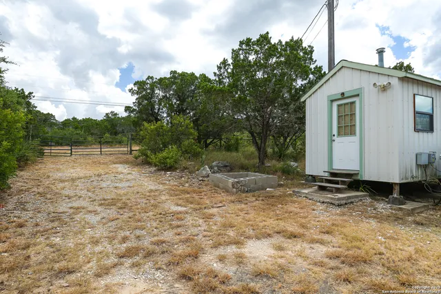 an aerial view of house with yard and outdoor space