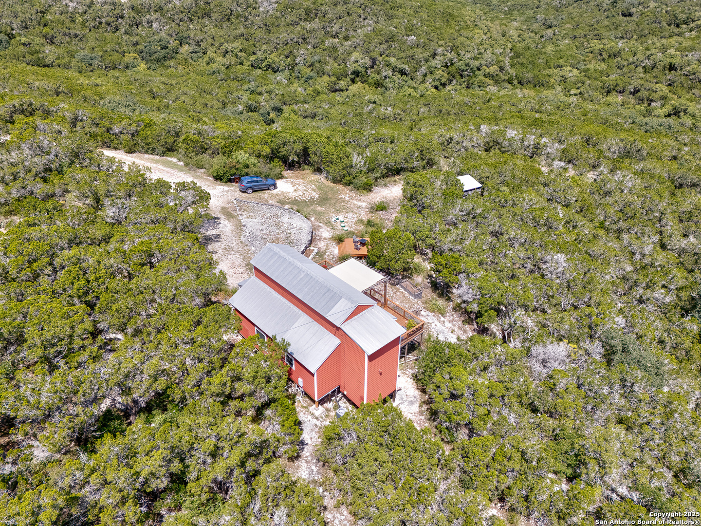 776 County Road 270 Mico, TX 78056 - Photo 55 of 59 a view of a house with a yard and trees