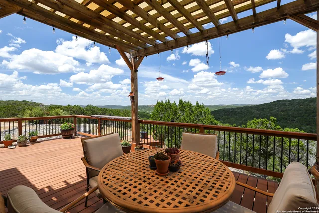 a view of a balcony with furniture