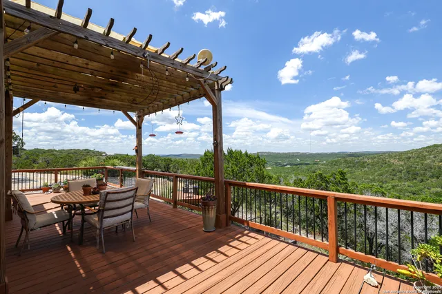 a view of two chairs in the balcony