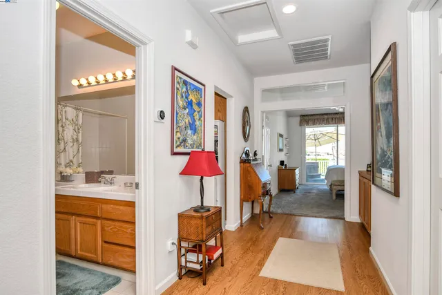 a very nice looking room with a large mirror and furniture