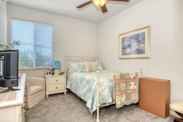 a bed room with a bed and a chandelier