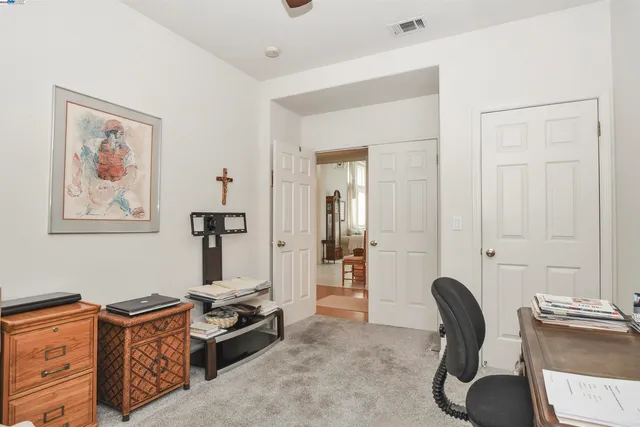 a room with furniture and a wooden floor