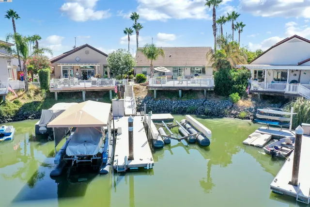 a aerial view of a house with swimming pool and patio