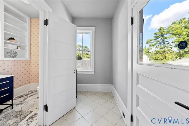 a bedroom with a large bed and a couch