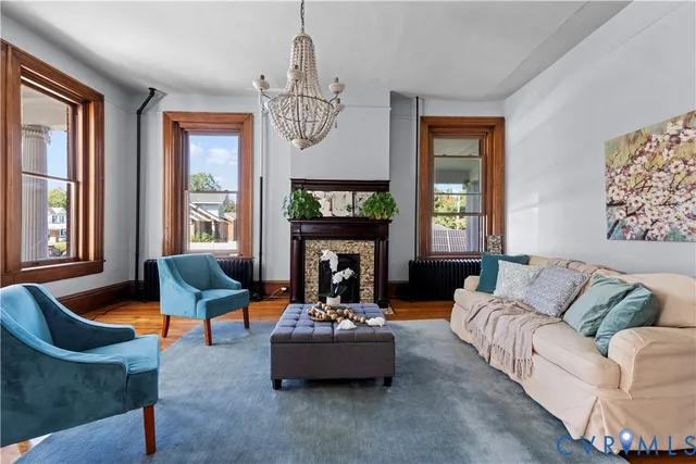 a large kitchen with stainless steel appliances granite countertop a refrigerator a sink dishwasher a stove with wooden cabinets and floor