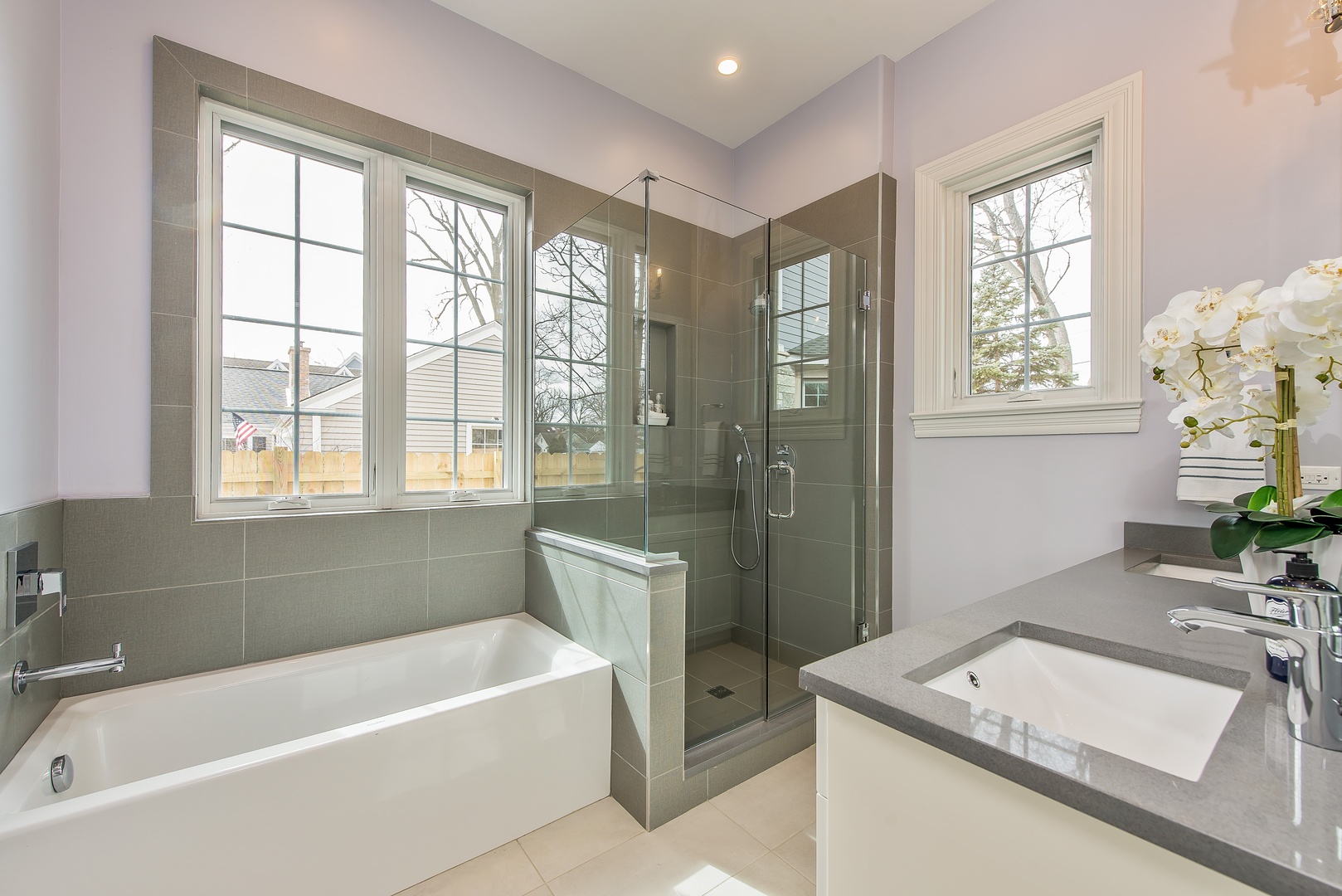 290 Thackeray Lane Northfield, IL 60093 - Photo 13 of 30 a bathroom with a tub sink and mirror