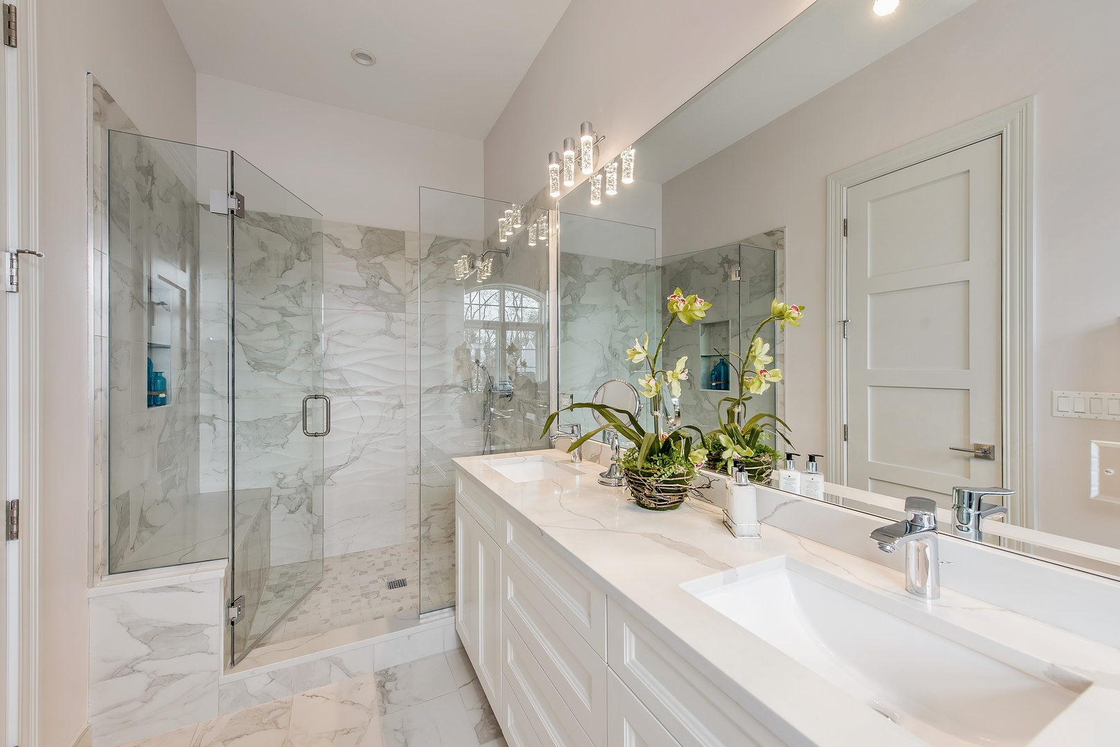 290 Thackeray Lane Northfield, IL 60093 - Photo 17 of 30 a bathroom with a sink double vanity and shower