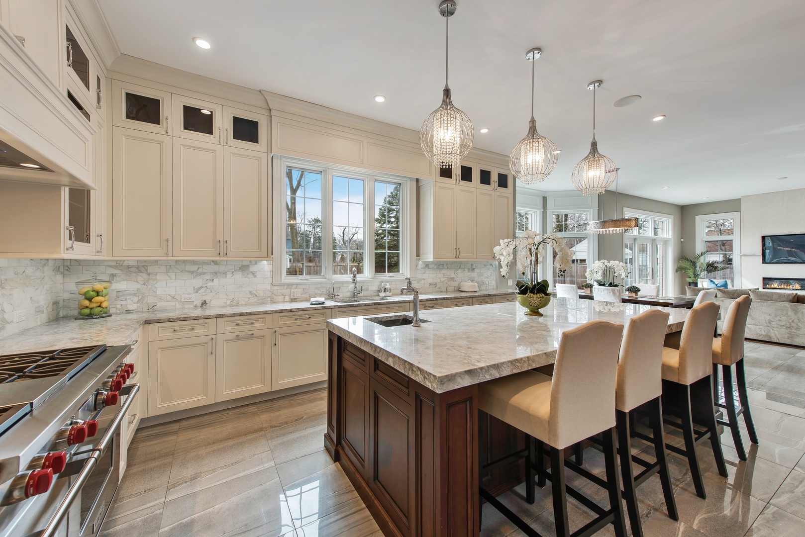 290 Thackeray Lane Northfield, IL 60093 - Photo 5 of 30 a kitchen with stainless steel appliances granite countertop a stove a sink a oven a dining table and chairs
