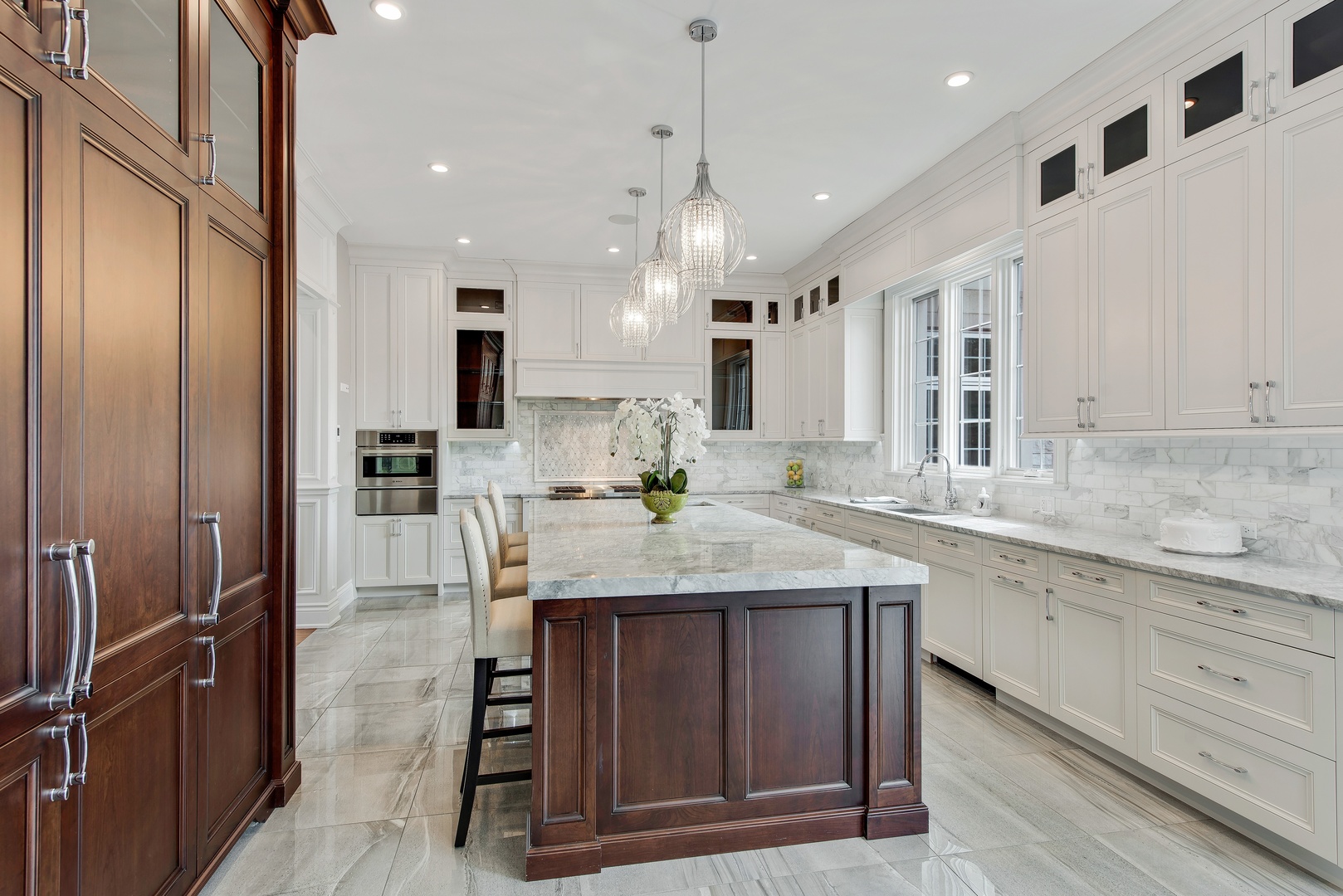 290 Thackeray Lane Northfield, IL 60093 - Photo 6 of 30 a kitchen with kitchen island granite countertop wooden cabinets and refrigerator