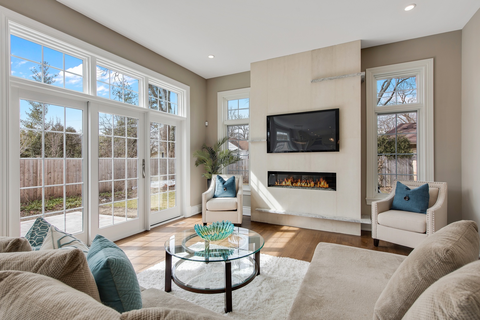 290 Thackeray Lane Northfield, IL 60093 - Photo 8 of 30 a living room with furniture floor to ceiling window and a flat screen tv