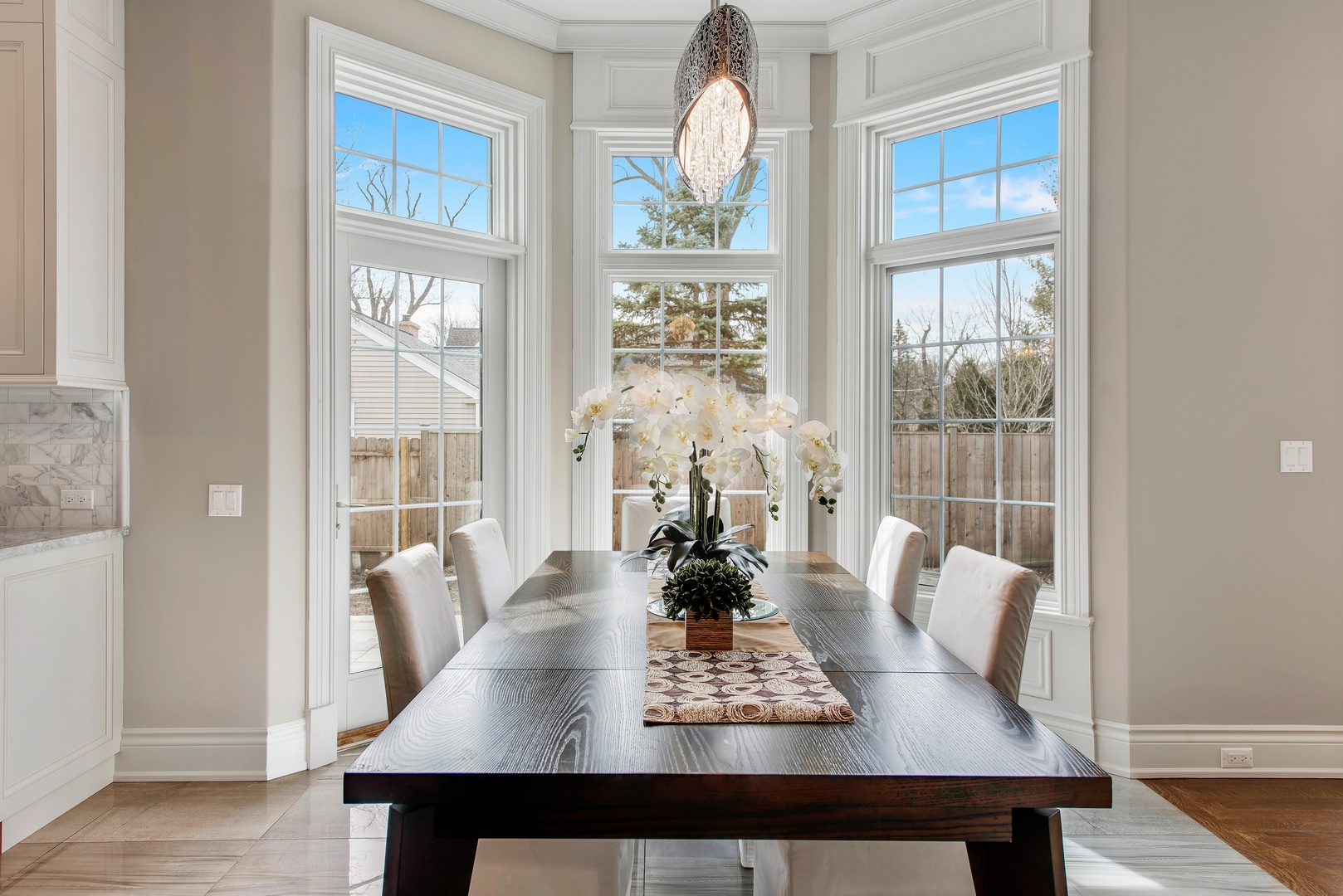 290 Thackeray Lane Northfield, IL 60093 - Photo 9 of 30 a view of a dining room with furniture wooden floor and chandelier