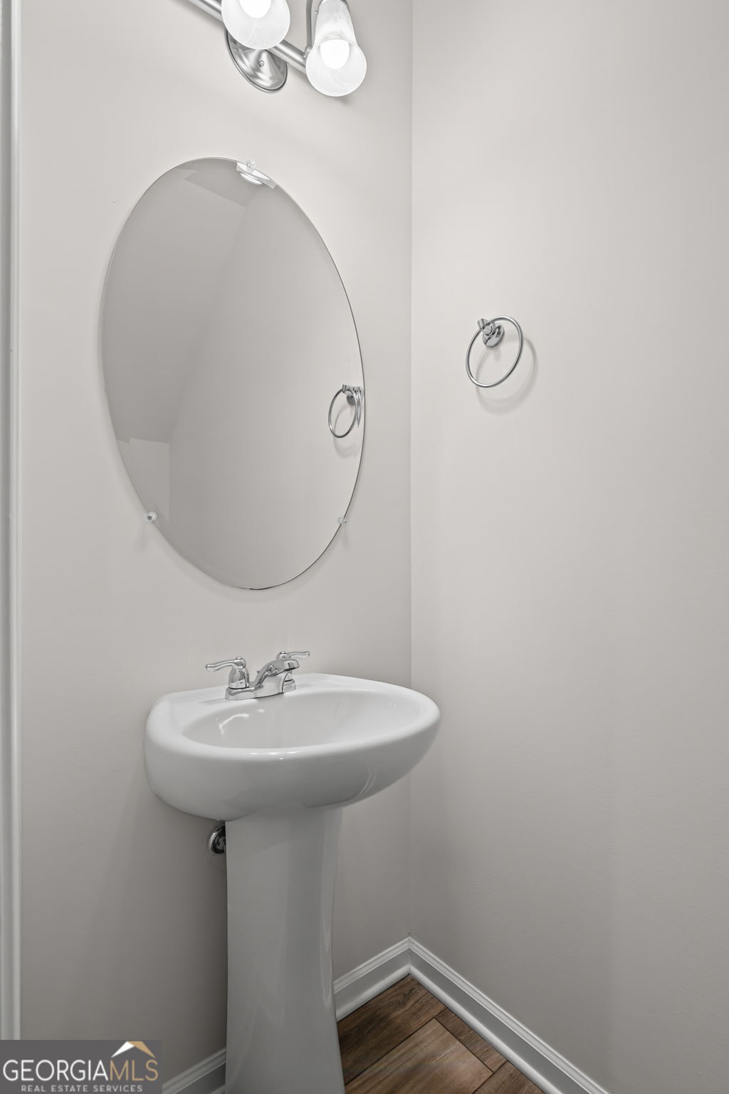 1002 Depot Street Cartersville, GA 30120 - Photo 13 of 29 a bathroom with a sink a mirror and a toilet