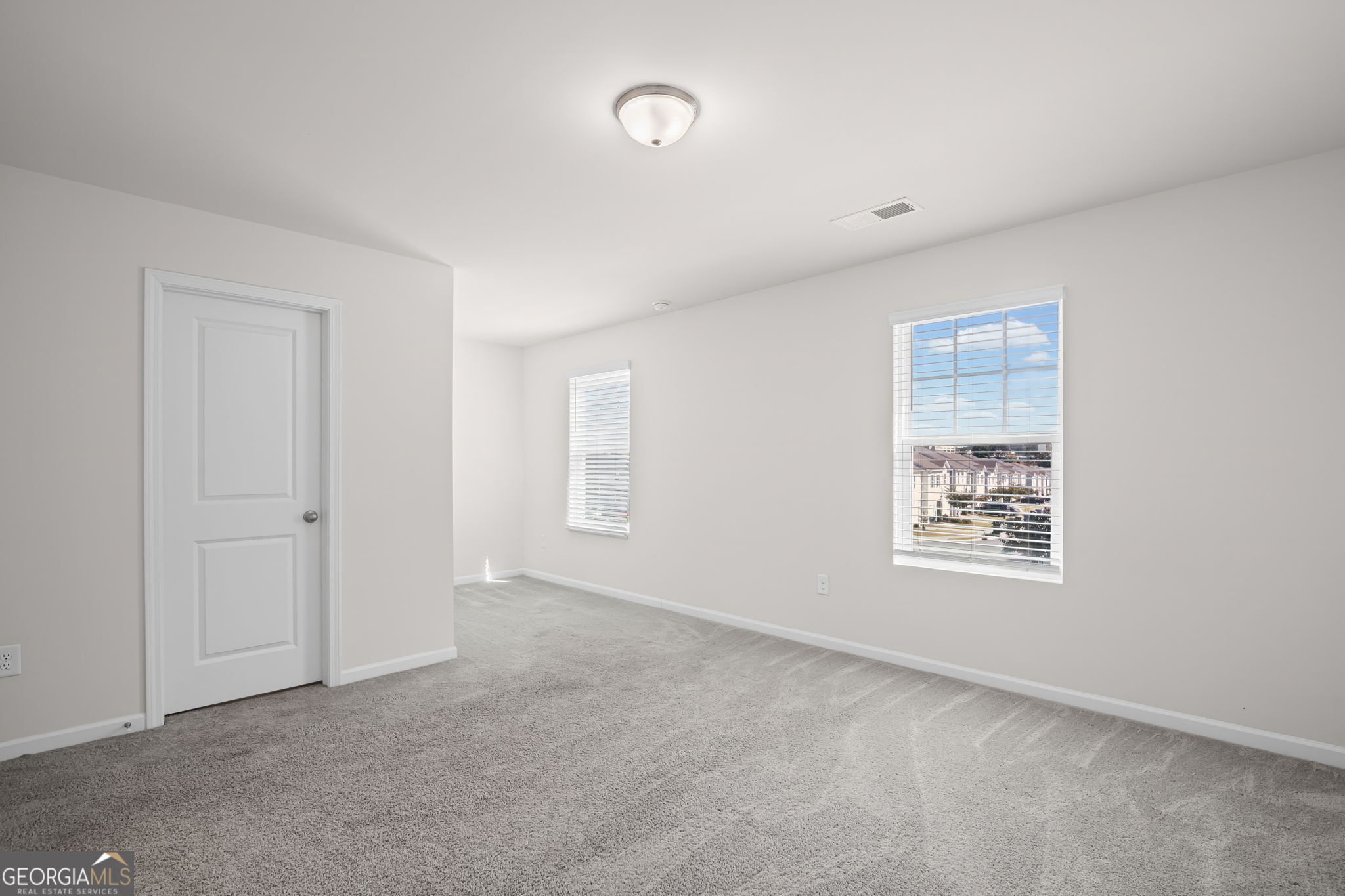 1002 Depot Street Cartersville, GA 30120 - Photo 24 of 29 a view of an empty room with a window