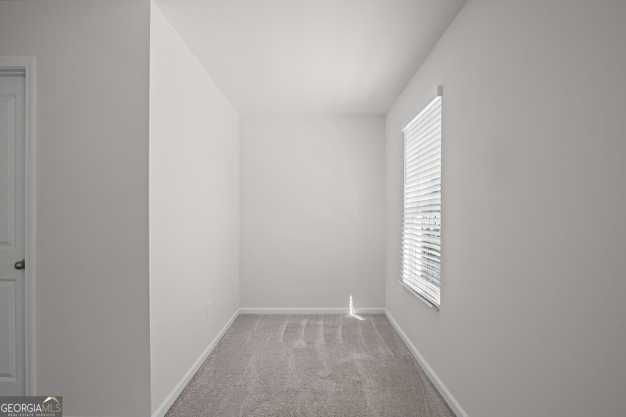 1002 Depot Street Cartersville, GA 30120 - Photo 25 of 29 a view of an empty room and a window