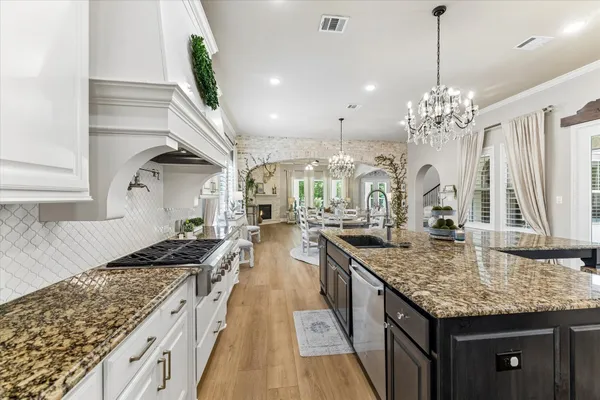 a kitchen with counter top space and a wooden floor