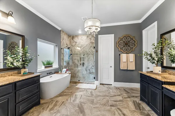 a white bath tub sitting next to a shower