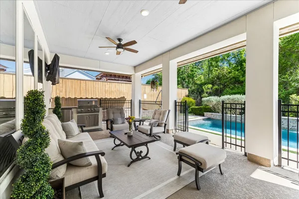 a view of a backyard with sitting area