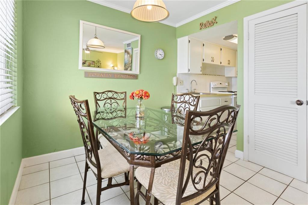 17300 Gulf Boulevard, Unit 9 North Redington Beach, FL 33708 - Photo 5 of 15 a view of a dining room with furniture and chandelier