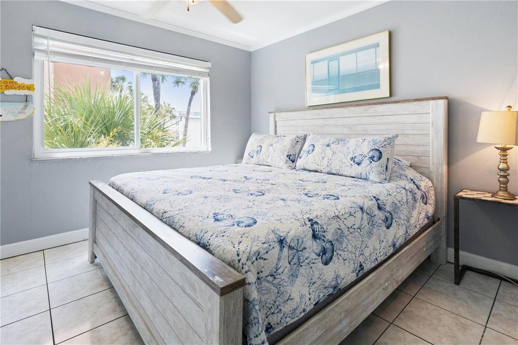 17300 Gulf Boulevard, Unit 9 North Redington Beach, FL 33708 - Photo 8 of 15 a bedroom with a bed and window