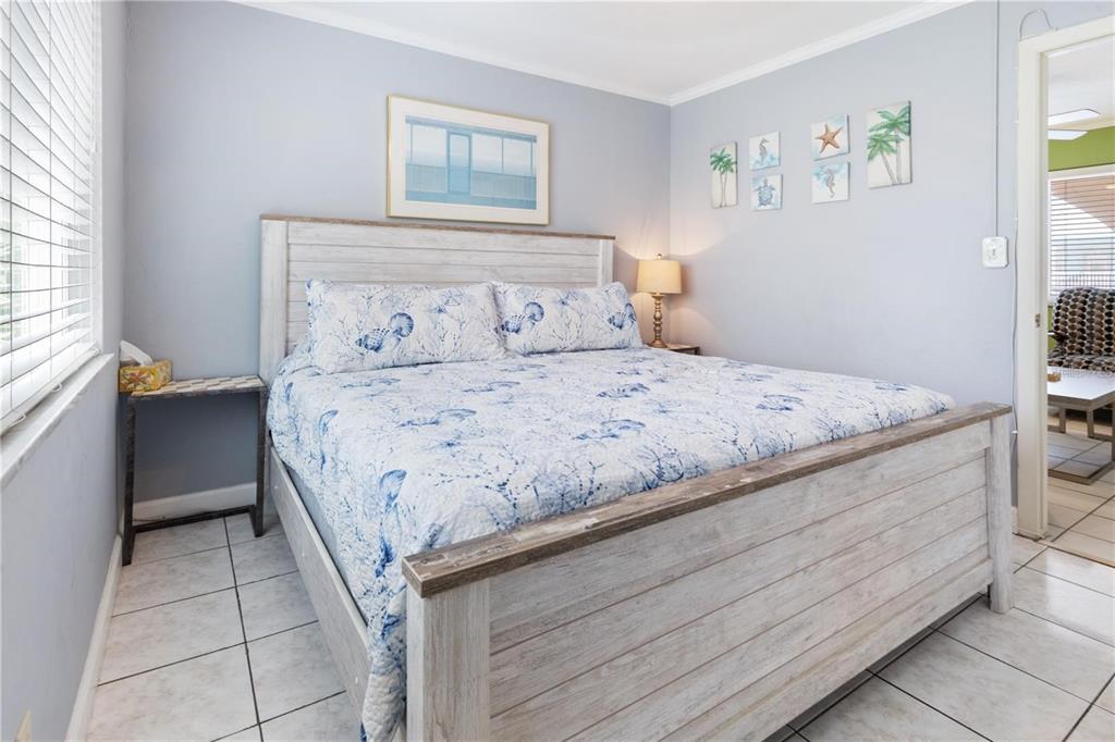 17300 Gulf Boulevard, Unit 9 North Redington Beach, FL 33708 - Photo 9 of 15 a bedroom with a bed and a window