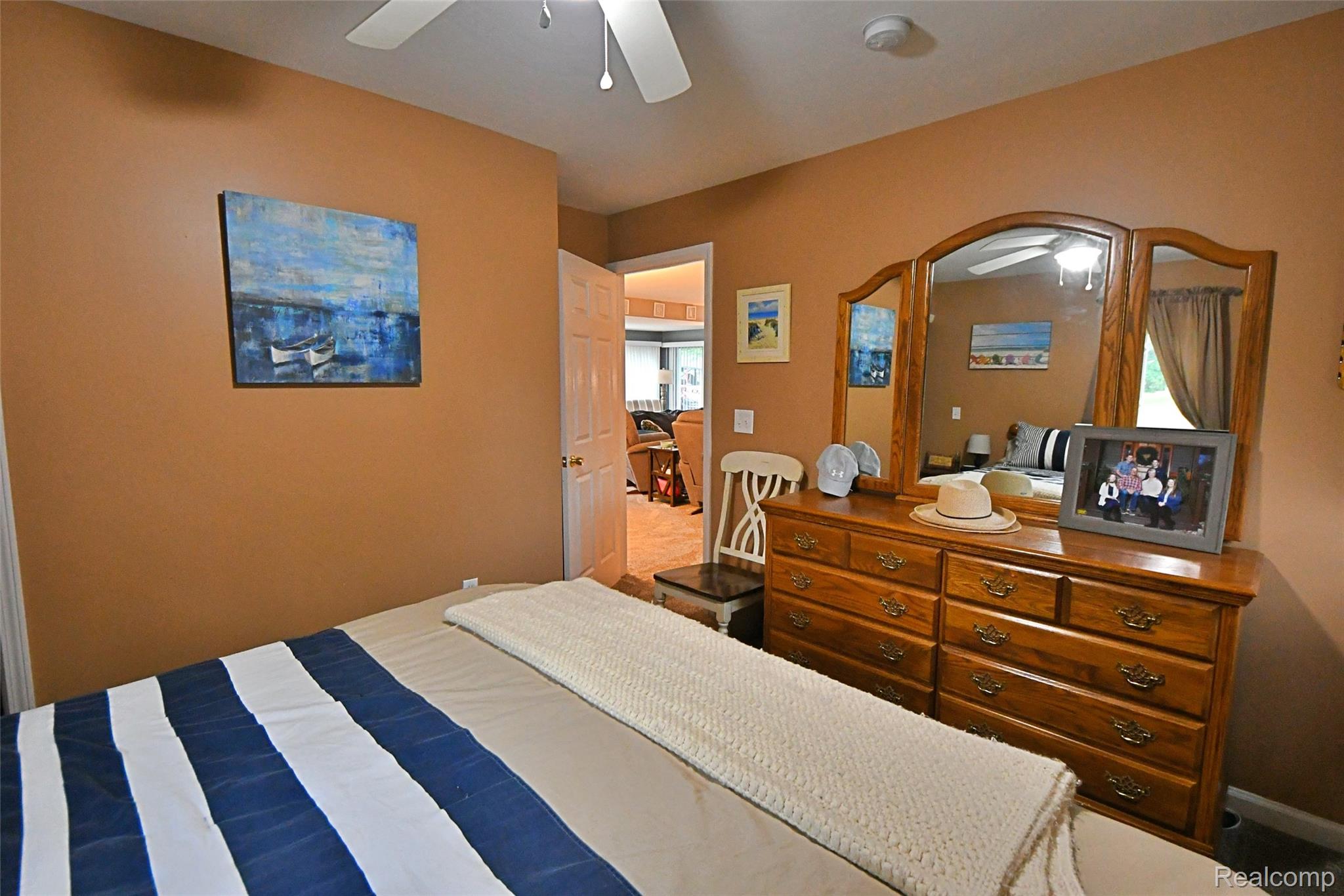 9611 Monroe Road St. Helen, MI 48656 - Photo 14 of 24 Interior room with warm-toned walls and a white ceiling fan
