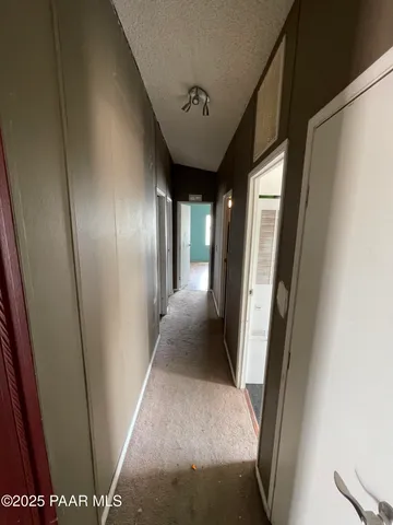 a bathroom with a sink a toilet and shower curtain