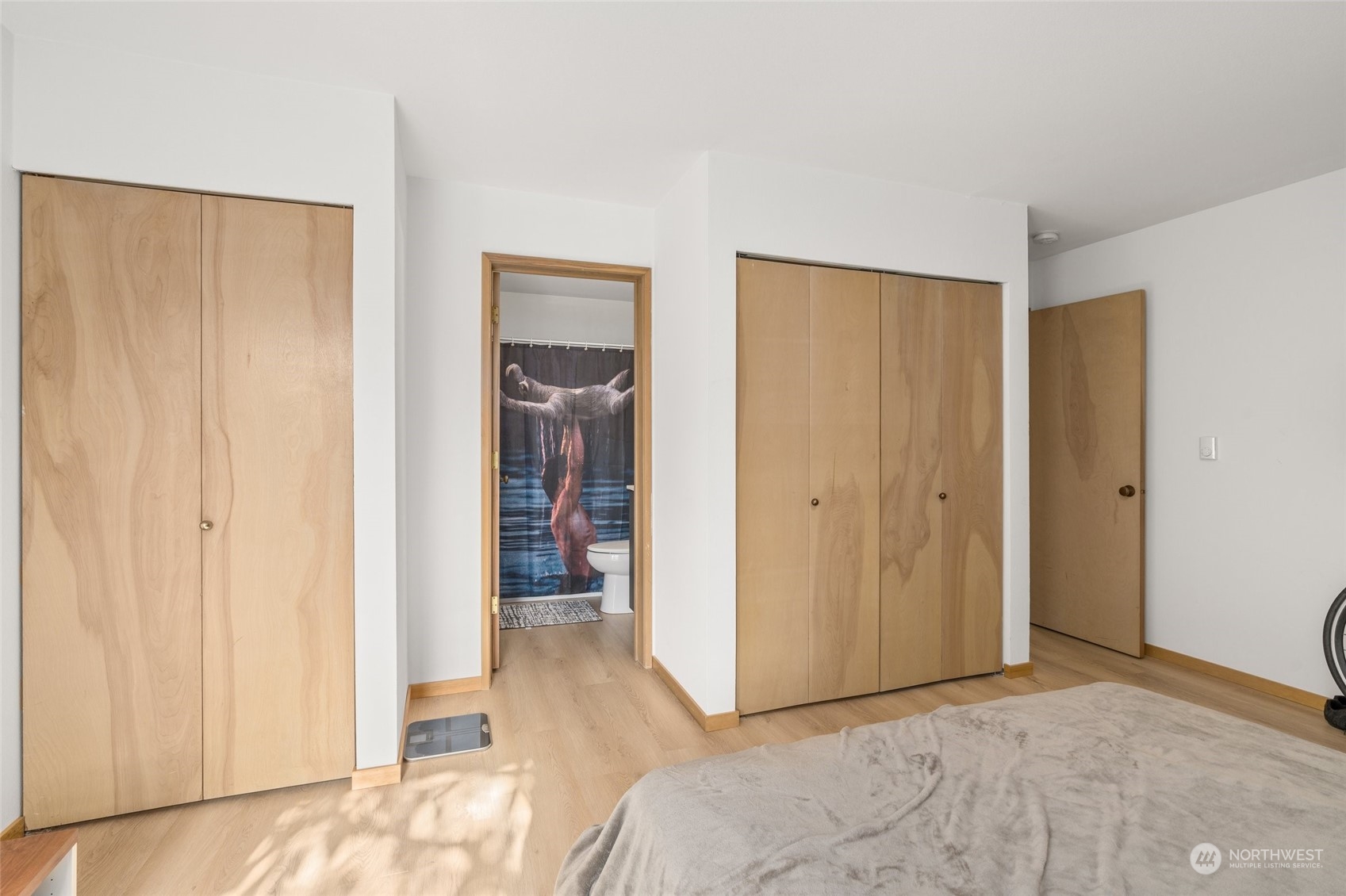 3435 Burke Avenue North Seattle, WA 98103 - Photo 11 of 21 a view of a room with a wardrobe space