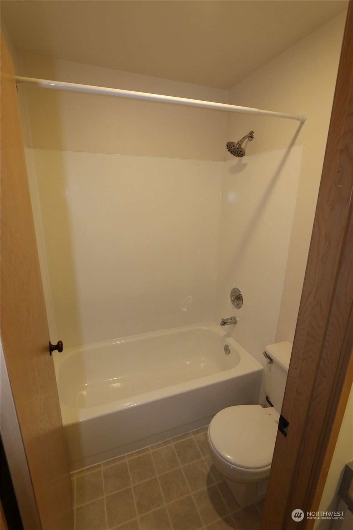 3435 Burke Avenue North Seattle, WA 98103 - Photo 21 of 21 a white toilet sitting next to a bath tub and a shower