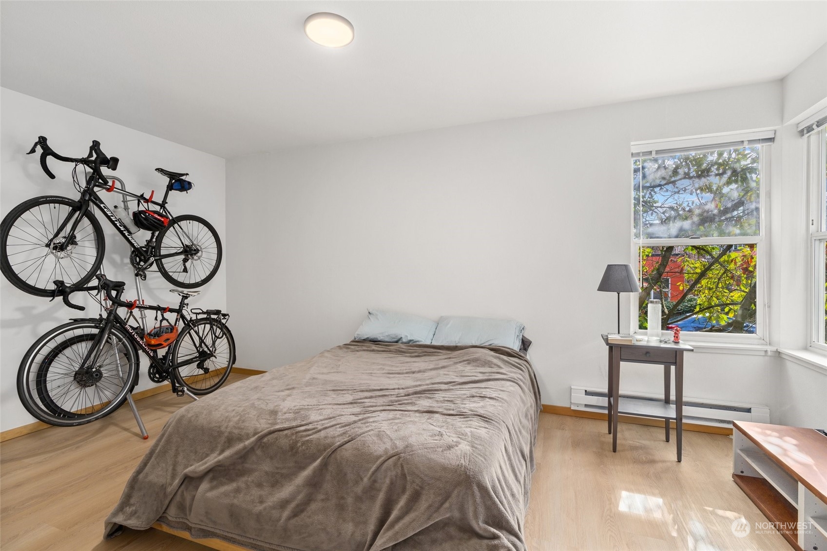3435 Burke Avenue North Seattle, WA 98103 - Photo 10 of 21 a bedroom with a bed and a table in it