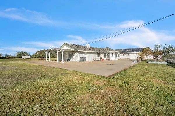 a view of a field with sitting area