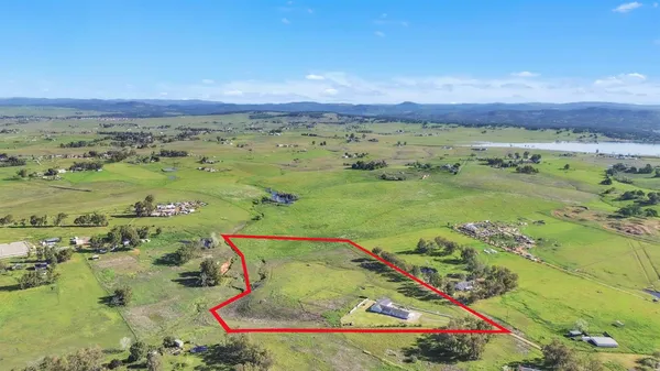 a view of a lake with houses in the back
