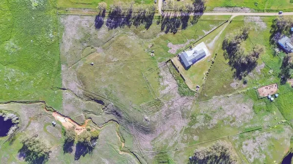 a living room with kitchen island furniture and a chandelier