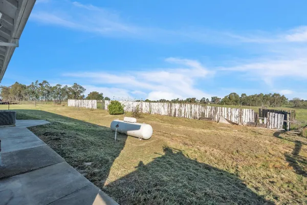 a big room with wooden fence