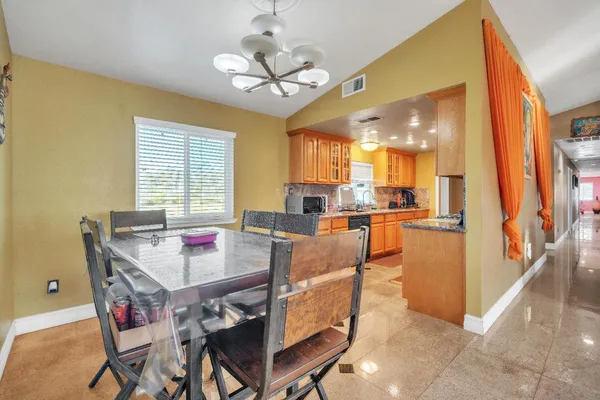 a bedroom with furniture and a mirror