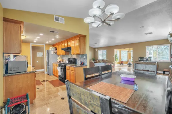 a spacious bathroom with a toilet a sink and a shower