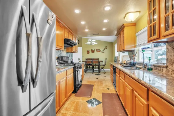 a bathroom with a toilet mirror and vanity