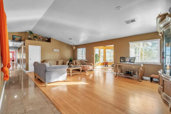 a living room with furniture rug and window