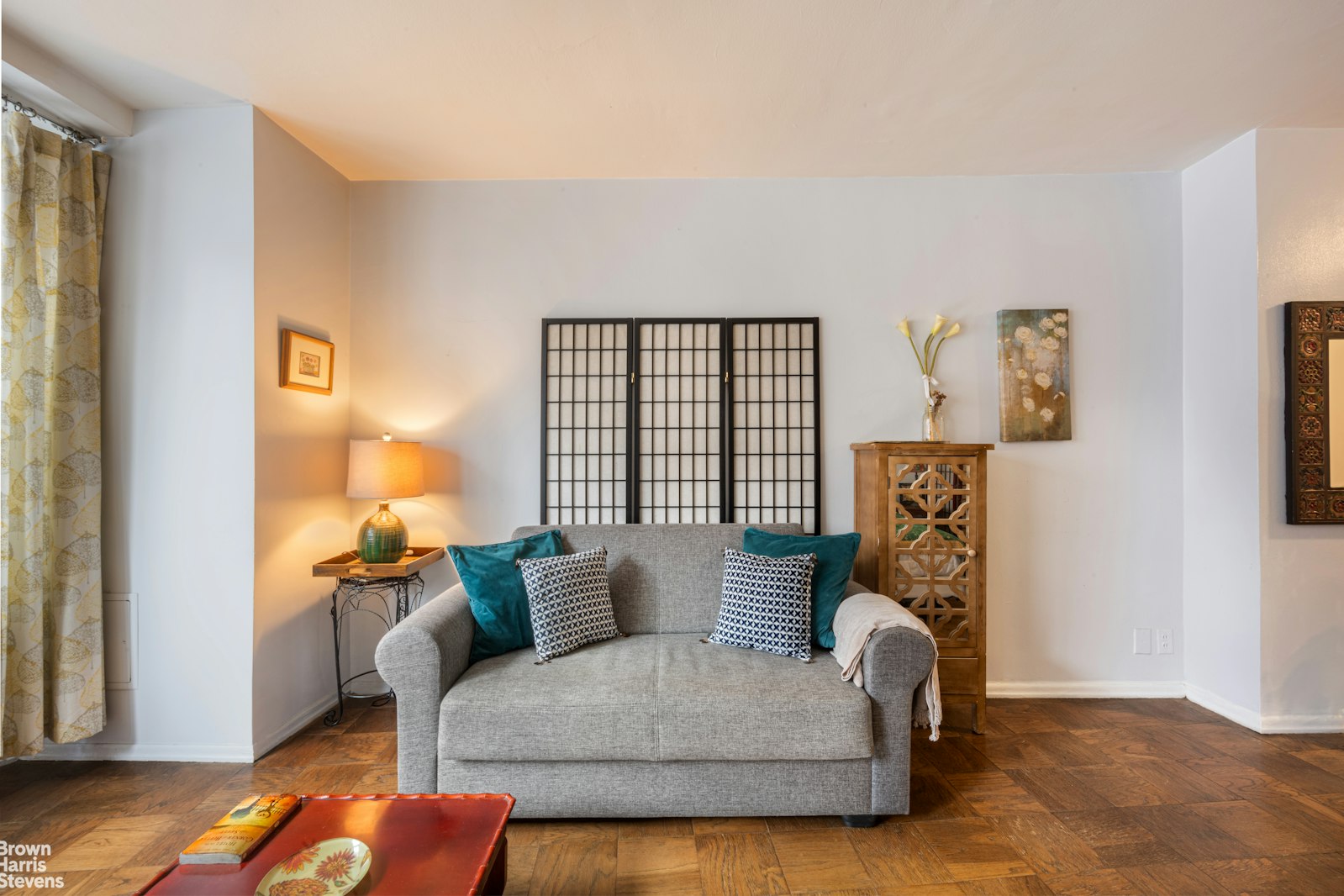 225 East 36th Street, Unit 5C Manhattan, NY 10016 - Photo 2 of 7 a living room with furniture and a window