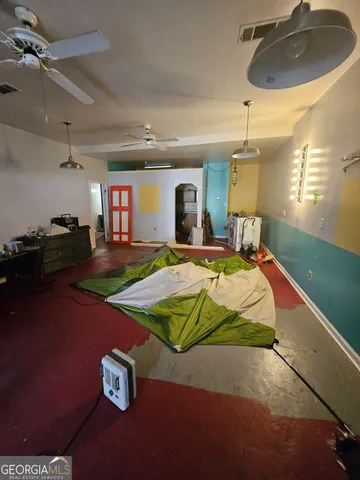 a bed room with a bed and a chair