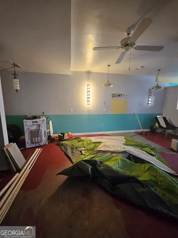 a bedroom with a bed and a mirror