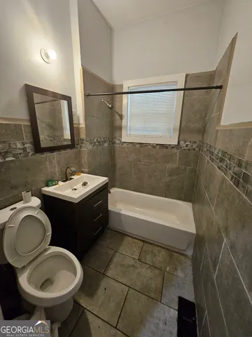 a room with gym equipment and a mirror